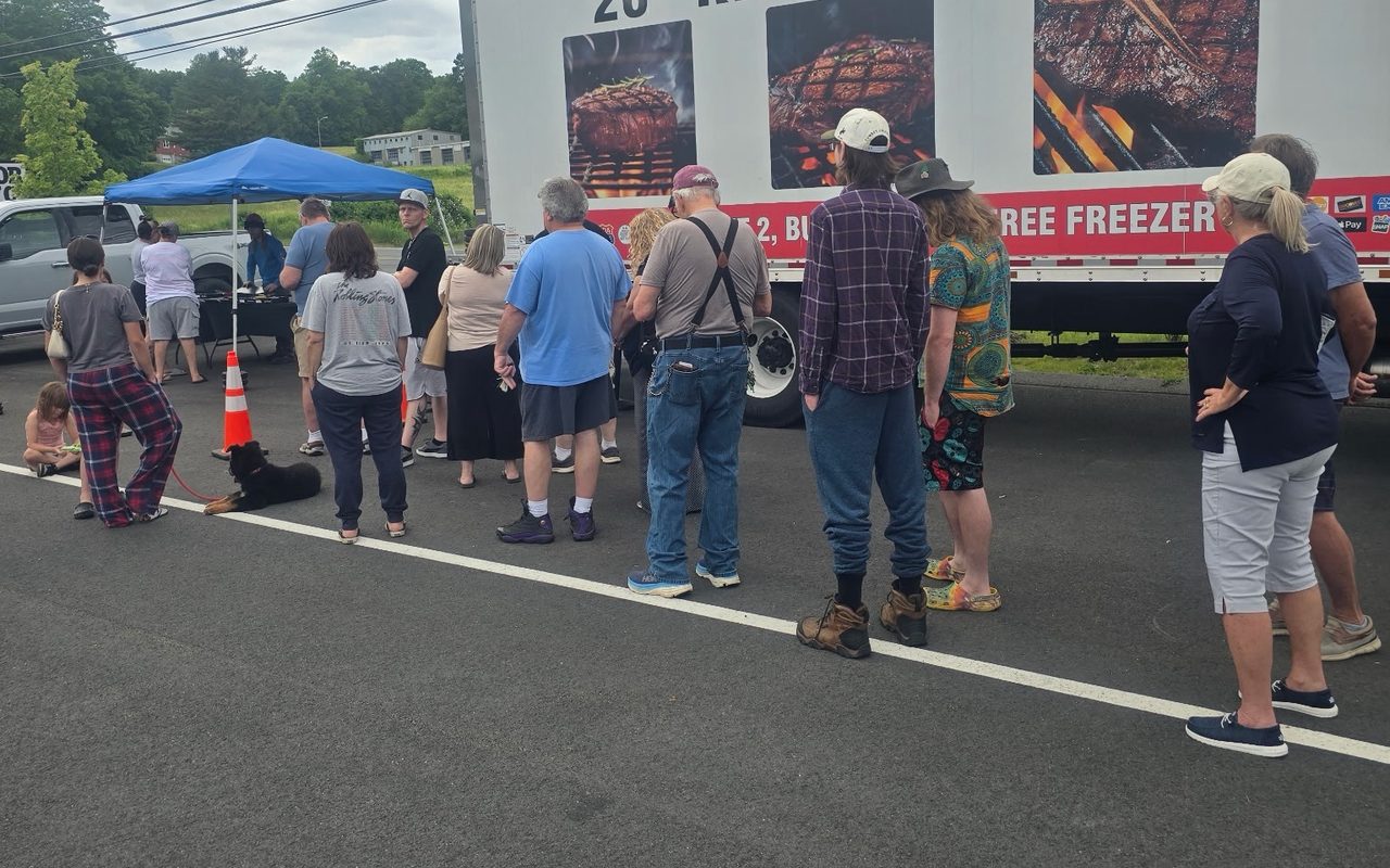 A line of customers waiting at the truck