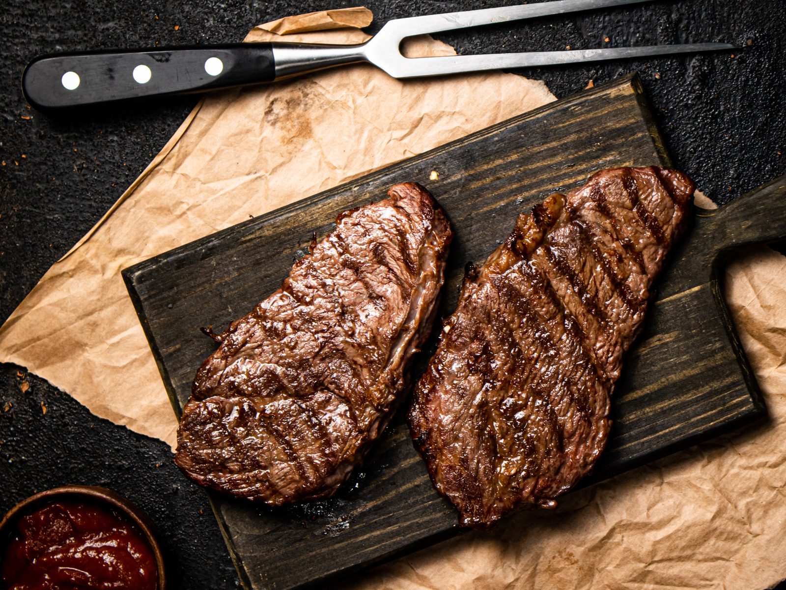 Grilled steaks on a cutting board
